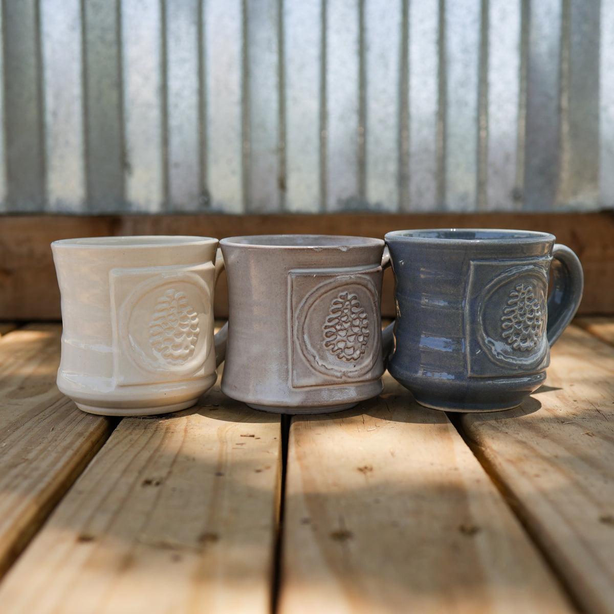 http://store.pinecove.com/cdn/shop/files/pottery_mugs_1200x1200.jpg?v=1694649632